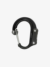 Load image into Gallery viewer, Pictured in black for the swivel hook and the inner clip is a closed, medium-sized metal carabiner. This is the HeroClip Medium in Stealth Black. Perfect for your roof top tent adventure camp tool hanging needs! Available for sale by SMRT Tent in Edmonton, Canada.