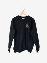 Load image into Gallery viewer, Pictured is the front of a Black Crewneck sweatshirt with the words Get Out More. stitched over the upper-left chest area in White. Chill out around your SMRT Tent roof top tent in this comfy crew! Available for sale by SMRT Tent in Edmonton, Canada.