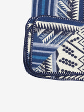 Load image into Gallery viewer, Pictured is a close-up view of the underside of a blue and white patterned, neatly folded baby blanket. This is the Heartprint Threads 'Small and Mighty' Baby Blanket, created by Ecuadorian Artisans. Perfect for your everyday soft & warm baby blanket needs! Available for sale at SMRT Tent in Edmonton, Canada.