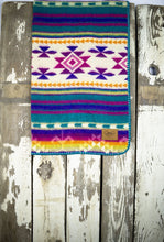 Load image into Gallery viewer, Pictured is a violet, lightly sandy white, bright yellow, pale yellow, bright orange, magenta, cream, purple and white coloured, traditional Aztec patterned baby blanket. This is the technicolour Heartprint Threads 'Wild One' Baby Blanket, created by Ecuadorian Artisans. Perfect for your everyday soft & warm baby blanket needs! Available for sale at SMRT Tent in Edmonton, Canada.