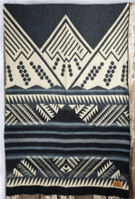 Load image into Gallery viewer, Pictured is a dark grey, cream & light blue, mountain-patterned and laid-out blanket. This is the Heartprint Threads 'Cave of Crystals' Mountain Flakes Line Queen Blanket, created by Ecuadorian Artisans. Throw this warm blanket over your sleeping bag while camping outdoors! Available for sale at SMRT Tent in Edmonton, Canada.