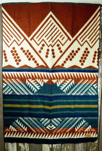 Load image into Gallery viewer, Pictured is an orange, teal, dark blue & white, mountain-patterned and laid-out blanket. This is the Heartprint Threads 'The Bench' Mountain Flakes Line Queen Blanket, created by Ecuadorian Artisans. Throw this warm blanket over your sleeping bag while camping outdoors! Available for sale at SMRT Tent in Edmonton, Canada.