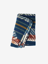 Load image into Gallery viewer, Pictured is a dark blue, mountain-patterned and neatly folded blanket. This is the Heartprint Threads ‘The Bench’ Mountain Flakes Line Queen Blanket, created by Ecuadorian Artisans. Throw this warm blanket over your sleeping bag while camping outdoors! Available for sale at SMRT Tent in Edmonton, Canada.