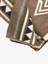 Load image into Gallery viewer, Pictured is a close-up of a brown, patterned and neatly folded blanket. This is a Heartprint Threads Tree Line Queen Blanket, created by Ecuadorian Artisans. Throw this warm blanket over your sleeping bag while camping outdoors! Available for sale at SMRT Tent in Edmonton, Canada.