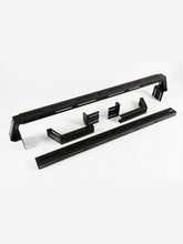 Load image into Gallery viewer, Pictured are two black, 6-inch aluminum crossbars. One is fully assembled and the other is neatly disassembled. This is the Universal Bed Crossbar Kit, perfect for any truck bed in your overland roof top tent camping! Available for sale by SMRT Tent in Edmonton, Canada.
