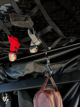 Load image into Gallery viewer, Pictured in a close-up shot is a mesh net storage pocket from our softshell roof top tent. This is “The” Softshell, a roof top tent perfect for all overland roof top tent family outdoor camping! Available for sale by SMRT Tent in Edmonton, Canada.