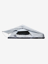 Load image into Gallery viewer, Pictured in a light, white-ish grey is a completely set-up softshell roof top tent. This is “The” Softshell, a roof top tent perfect for all overland roof top tent family outdoor camping! Available for sale by SMRT Tent in Edmonton, Canada.
