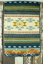 Load image into Gallery viewer, Pictured is a yellowish peridot green, light blue, teal, dark blue, grey, lightly greyish mauve, orange and cream coloured, traditional Aztec patterned baby blanket. This is the Heartprint Threads &#39;Sleep Like A Baby&#39; Baby Blanket, created by Ecuadorian Artisans. Perfect for your SMRT Tent roof top tents for trucks baby blanket needs! Available for sale at SMRT Tent in Edmonton, Canada.
