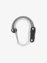Load image into Gallery viewer, Pictured in grey for the swivel hook and silver for the rest of the clip is a closed, medium-sized metal carabiner. This is the HeroClip Medium in Shade Of Grey. Perfect for your roof top tent adventure camp tool hanging needs! Available for sale by SMRT Tent in Edmonton, Canada.
