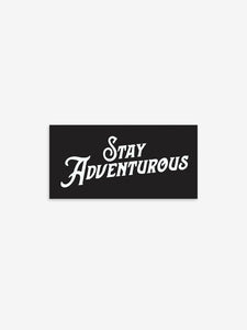 Pictured is a black rectangular sticker with the words Stay Adventurous in white. Perfect to show your passion for outdoor roof top tent camping! Available for sale by SMRT Tent in Edmonton, Canada.