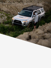 Load image into Gallery viewer, Pictured is a silver Toyota SUV, specifically a 5th Gen 4Runner with the assembled 10-20 4Runner 5th Gen Modular Roof Rack on the car roof. The perfect fit and most compatible choice of modular roof rack for your Toyota 4Runner 5th Gen SUV! Available for sale by SMRT Tent in Edmonton, Canada.
