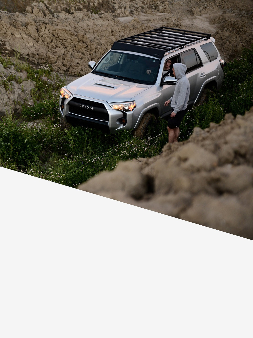 Pictured is a silver Toyota SUV, specifically a 5th Gen 4Runner with the assembled 10-20 4Runner 5th Gen Modular Roof Rack on the car roof. The perfect fit and most compatible choice of modular roof rack for your Toyota 4Runner 5th Gen SUV! Available for sale by SMRT Tent in Edmonton, Canada.