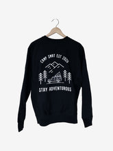 Load image into Gallery viewer,  Pictured is the back of a Black Crewneck sweatshirt which depicts in white outline; three mountains overlapping and 4 simple pine trees surrounding a Land Rover Defender 110 SUV with a hard shell roof top tent on its roof rack. The words above the image say Camp SMRT EST 2020 and are written in white. With the same for the words below the image that say Stay Adventurous. nt in this comfy crew! Available for sale by SMRT Tent in Edmonton, Canada.
