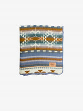 Load image into Gallery viewer, Pictured is a patterned and neatly folded blanket. This is the Heartprint Threads ‘Dusk Rose’ Aztec Series Double Blanket, created by Ecuadorian Artisans. Throw this warm blanket over your sleeping bag while camping outdoors! Available for sale at SMRT Tent in Edmonton, Canada.
