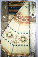 Load image into Gallery viewer, Pictured is an orange, patterned, laid-out and folded-out blanket. This is the Heartprint Threads ‘Vintage Velvet’ Aztec Series Double Blanket, created by Ecuadorian Artisans. Throw this warm blanket over your sleeping bag while camping outdoors! Available for sale at SMRT Tent in Edmonton, Canada.
