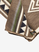 Load image into Gallery viewer, Pictured is a close-up of a brown, patterned and neatly folded blanket. This is a Heartprint Threads Tree Line Queen Blanket, created by Ecuadorian Artisans. Throw this warm blanket over your sleeping bag while camping outdoors! Available for sale at SMRT Tent in Edmonton, Canada.
