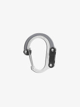 Load image into Gallery viewer, Pictured in grey for the closed swivel hook and matte greyish silver for the rest of the clip, is a small-sized metal carabiner. This is the HeroClip Small in Shades of Grey. Perfect for your roof top tent adventure camp tool hanging needs! Available for sale by SMRT Tent in Edmonton, Canada.
