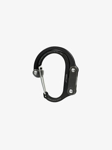 Pictured in black for the closed swivel hook and the clip, is a small-sized metal carabiner. This is the HeroClip Small in Stealth Black. Perfect for your roof top tent adventure camp tool hanging needs! Available for sale by SMRT Tent in Edmonton, Canada.
