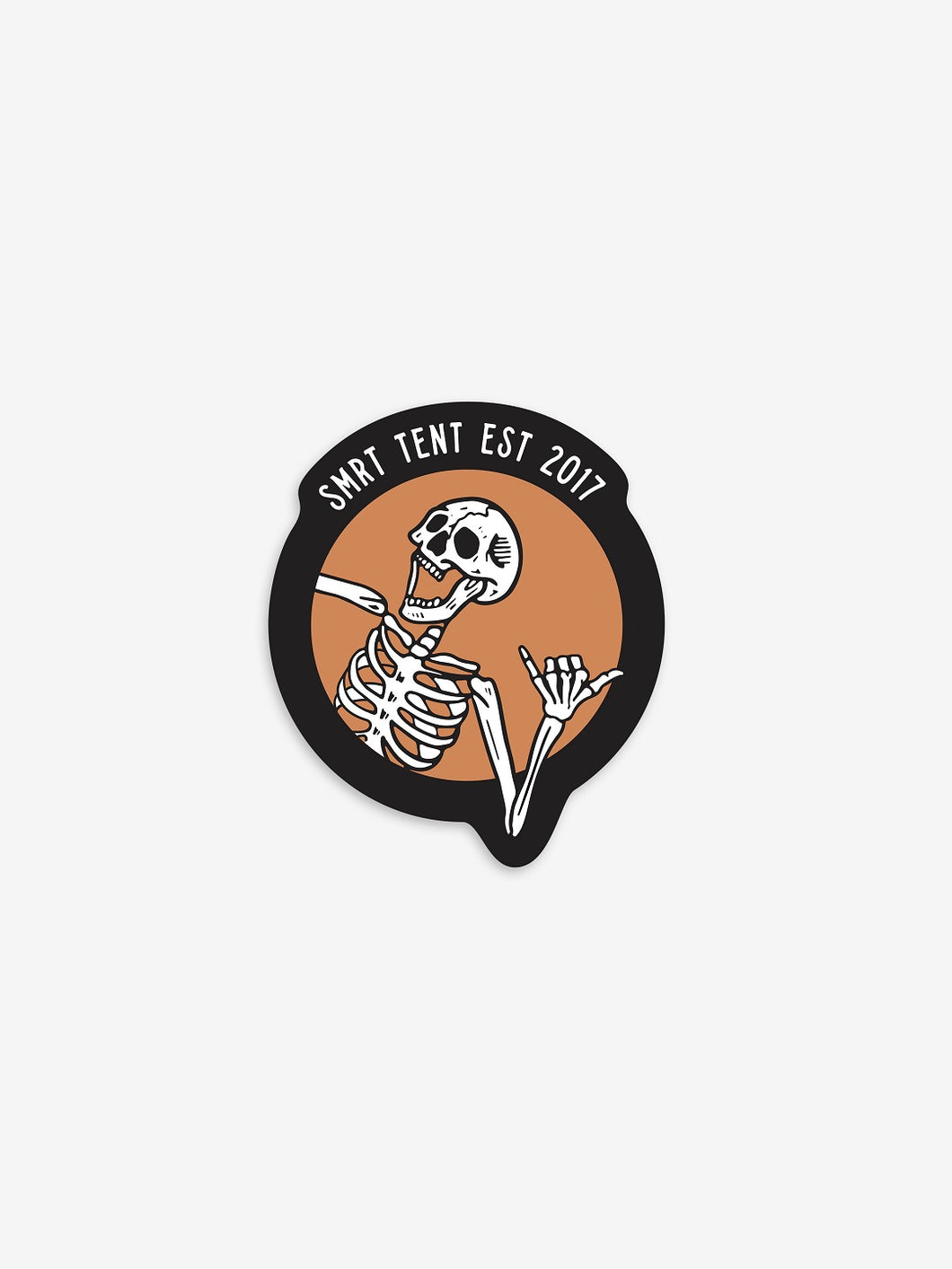 Pictured is a laughing white skeleton in-frame from the ribs up. All the fingers of the left hand are bent except for the thumb and pinky finger. The other hand and arm are out of frame. The backdrop is orange and outlined thickly with another frame in black where it says SMRT Tent Est 2017 in white text. Part of the left arm breaks out of the orange circle frame and overlaps with the black frame. Perfect to put on your car's dash or roof top tent! Available for sale by SMRT Tent in Edmonton, Canada.