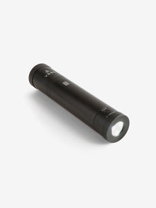 Pictured is a Black cylinder, the top end has the letters VSSL written in white, with the other end being a flashlight. This is the packed compact VSSL Camp Supplies. Perfect for your overland canada roof top tent camping supply needs! Available for sale by SMRT Tent in Edmonton, Canada.