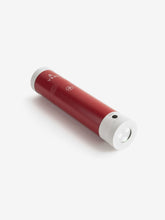 Load image into Gallery viewer, Pictured is a red cylinder, the top end has a white end cap and the letters VSSL written in white below it on the body of the cylinder, with the other white end cap being a flashlight. This is the packed compact VSSL First Aid. Perfect for your overland canada roof top tent camping first aid kit needs! Available for sale by SMRT Tent in Edmonton, Canada.
