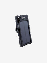 Load image into Gallery viewer, Pictured is a portable, Black solar powered power bank with its own medium-sized, black carabiner. The top end has a charging status shown by 4 LED lights and written above them is the logo for Kanan Outdoors written in white as KANAN and a stylized mountain. This is the Weatherproof Solar Power Bank and Flashlight with its own solar panel. Perfect while on your overland roof top tent camping for any recharging and flashlight needs! Available for sale by SMRT Tent in Edmonton, Canada.

